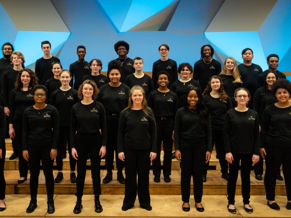 Singers posing on stage