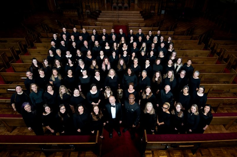 VocalEssence Chorus members wearing black pose for a photo. Photo Credit: Bruce Silcox